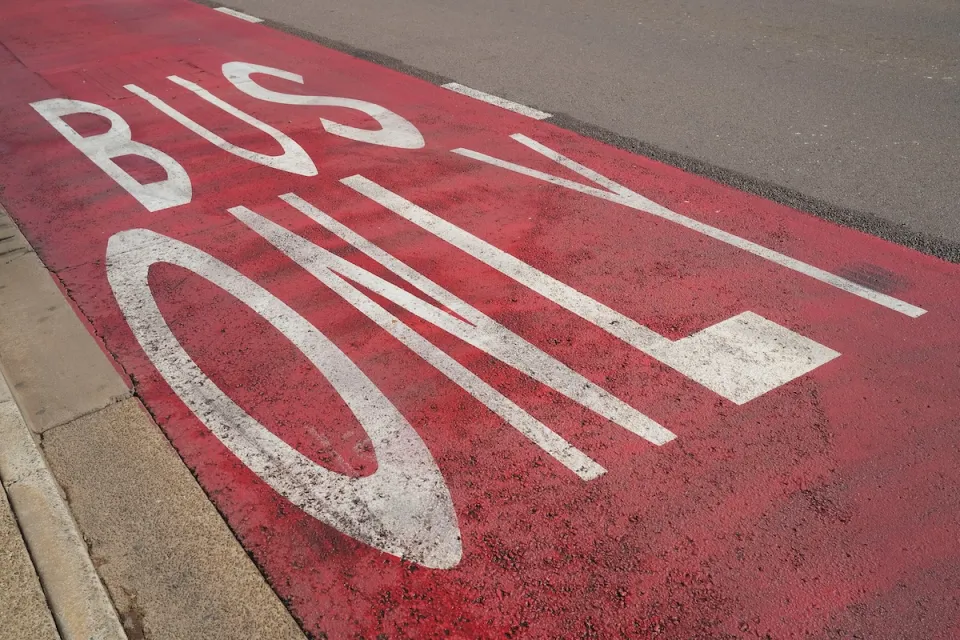 Close-up of red painted Bus Only lane.